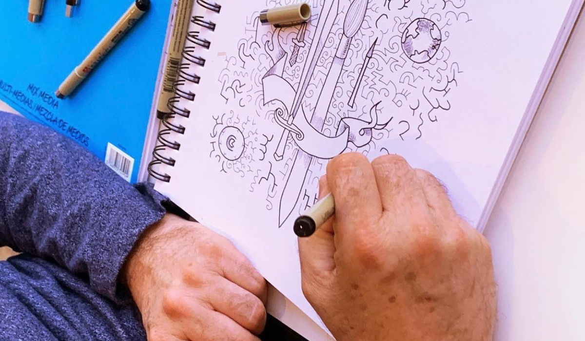 Hnads sketching in sketch book